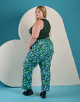 Angled back view of Work Pants in Angel Print and swamp green Cropped Tank on Juliet