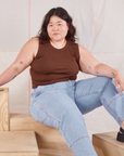 Ashley is wearing Muscle Tee in Fudgesicle Brown and light wash Carpenter Jeans