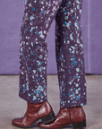 Pant leg close up of Marble Splatter Work Pants in Nebula Purple on Jesse