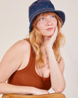 Margaret is wearing the Wide Brim Denim Bucket Hat in dark wash