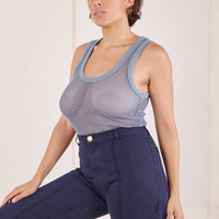 Angled view of Mesh Tank Top in Periwinkle and navy Western Pants worn by Tiara