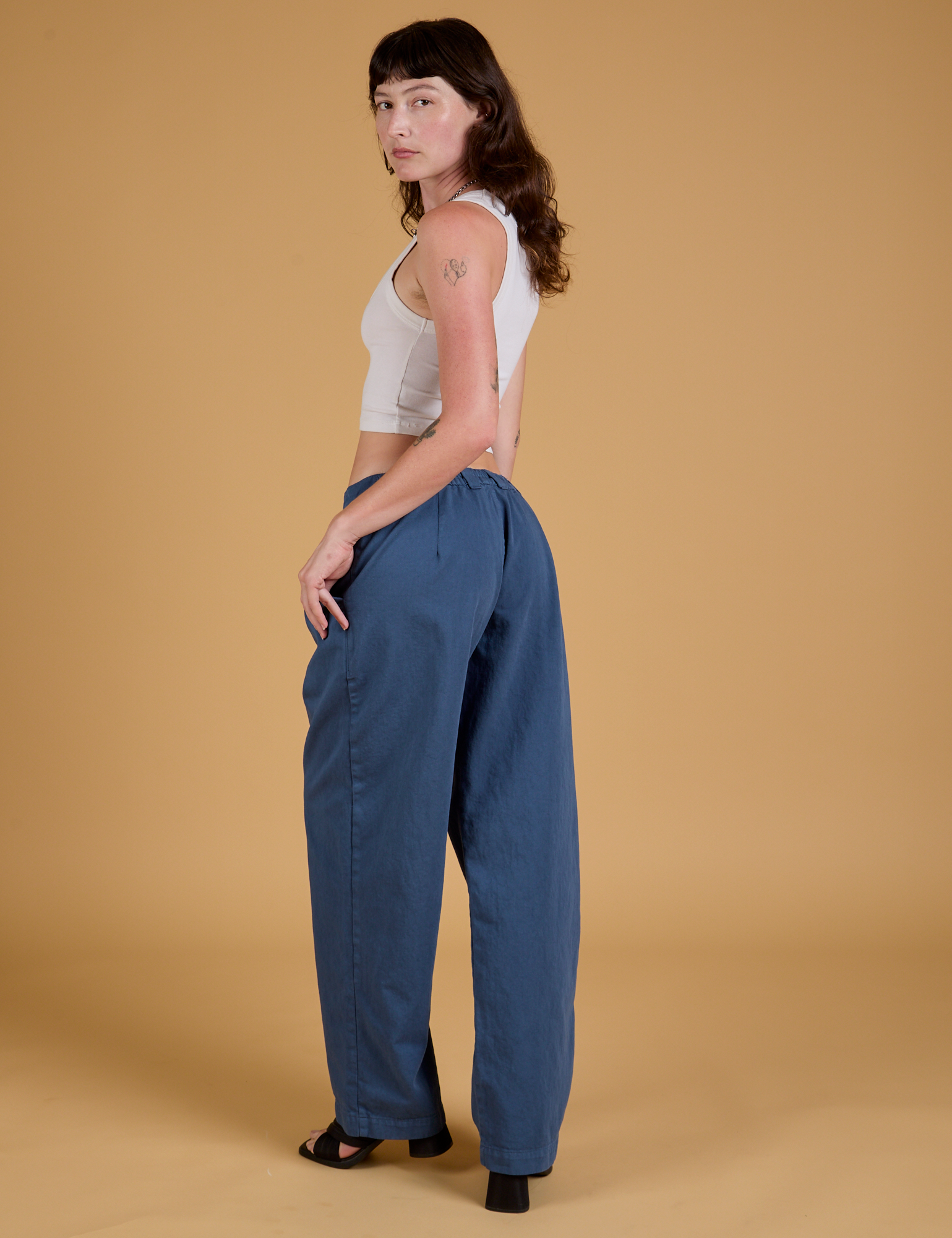 Baggy Mid-Rise Trousers in French Blue angled back view on Alex
