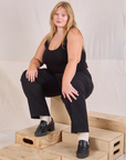 Juliet is wearing Mid-Rise Work Pants in Basic Black and black Cropped Tank