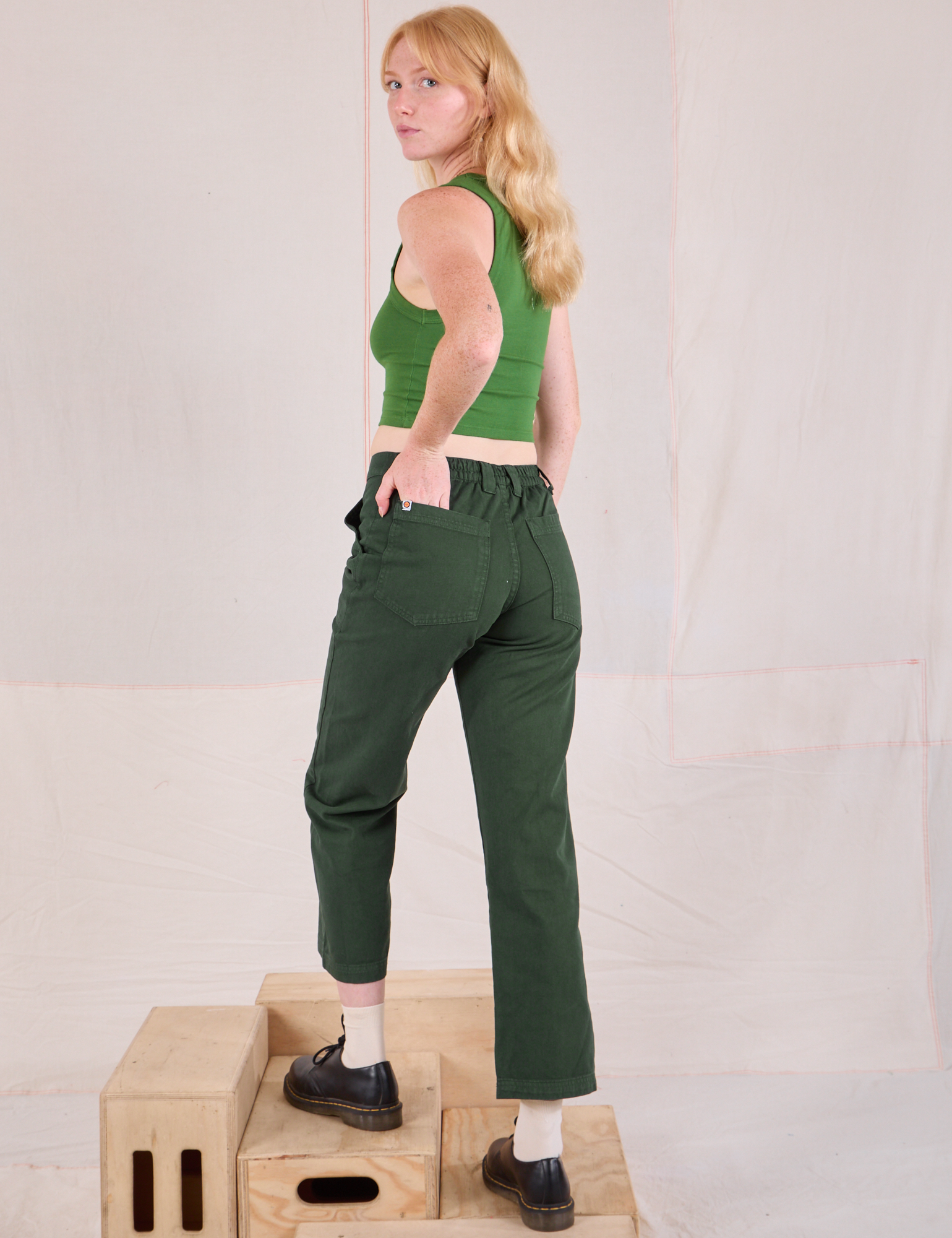 Mid-Rise Work Pants in Swamp Green angled back view on Margaret