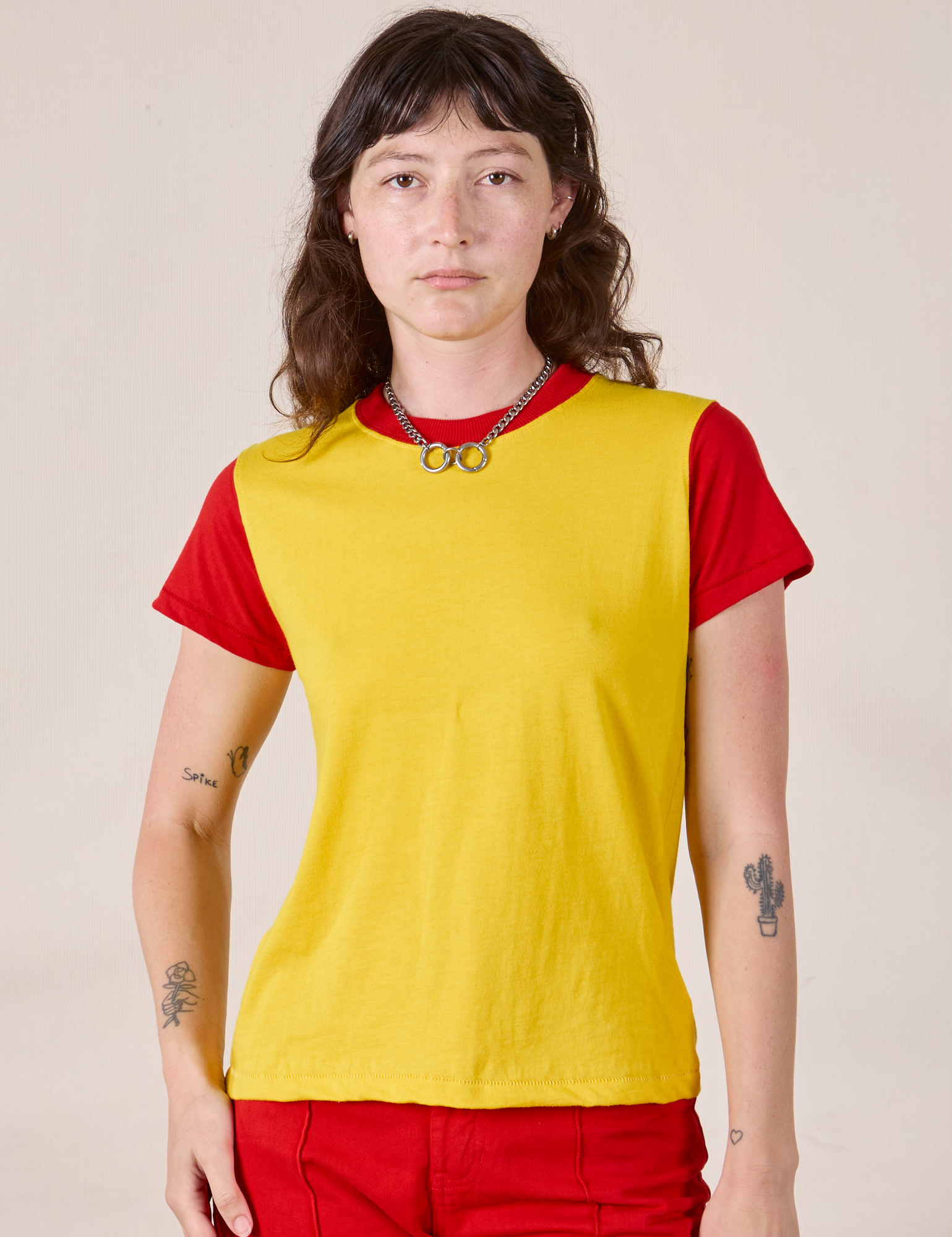Alex is wearing Mismatched Tee in Yellow &amp; Red