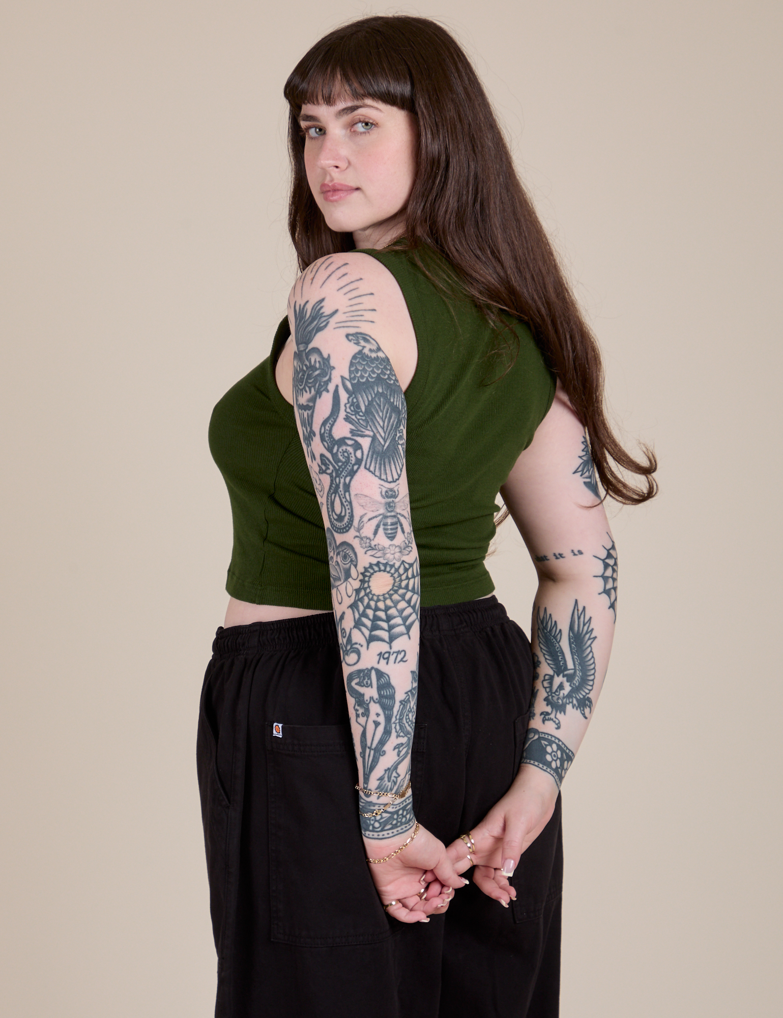 Angled back view of Muscle Tee in Evergreen on Sydney