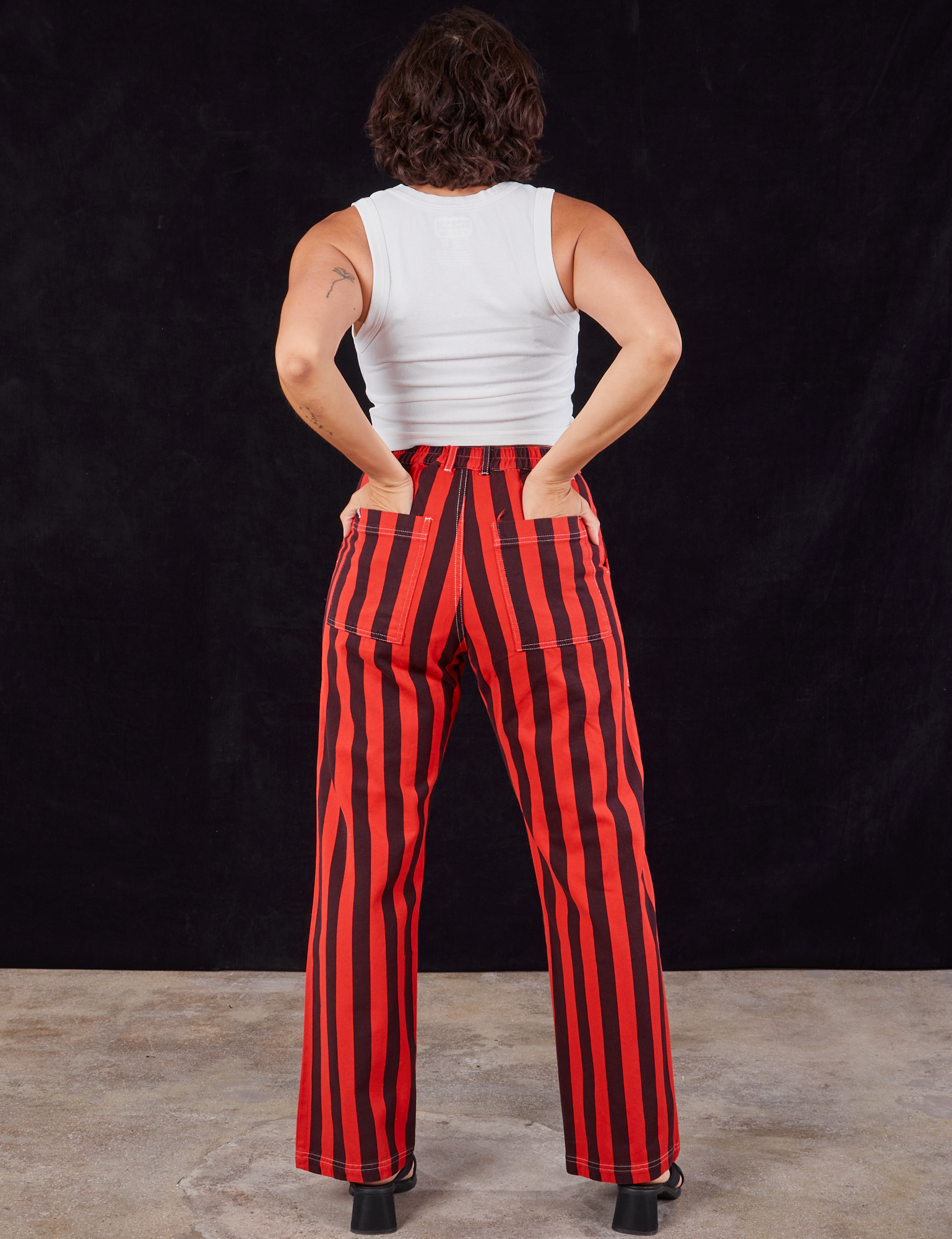 Black Stripe Work Pants in Mustang Red back view on Tiara