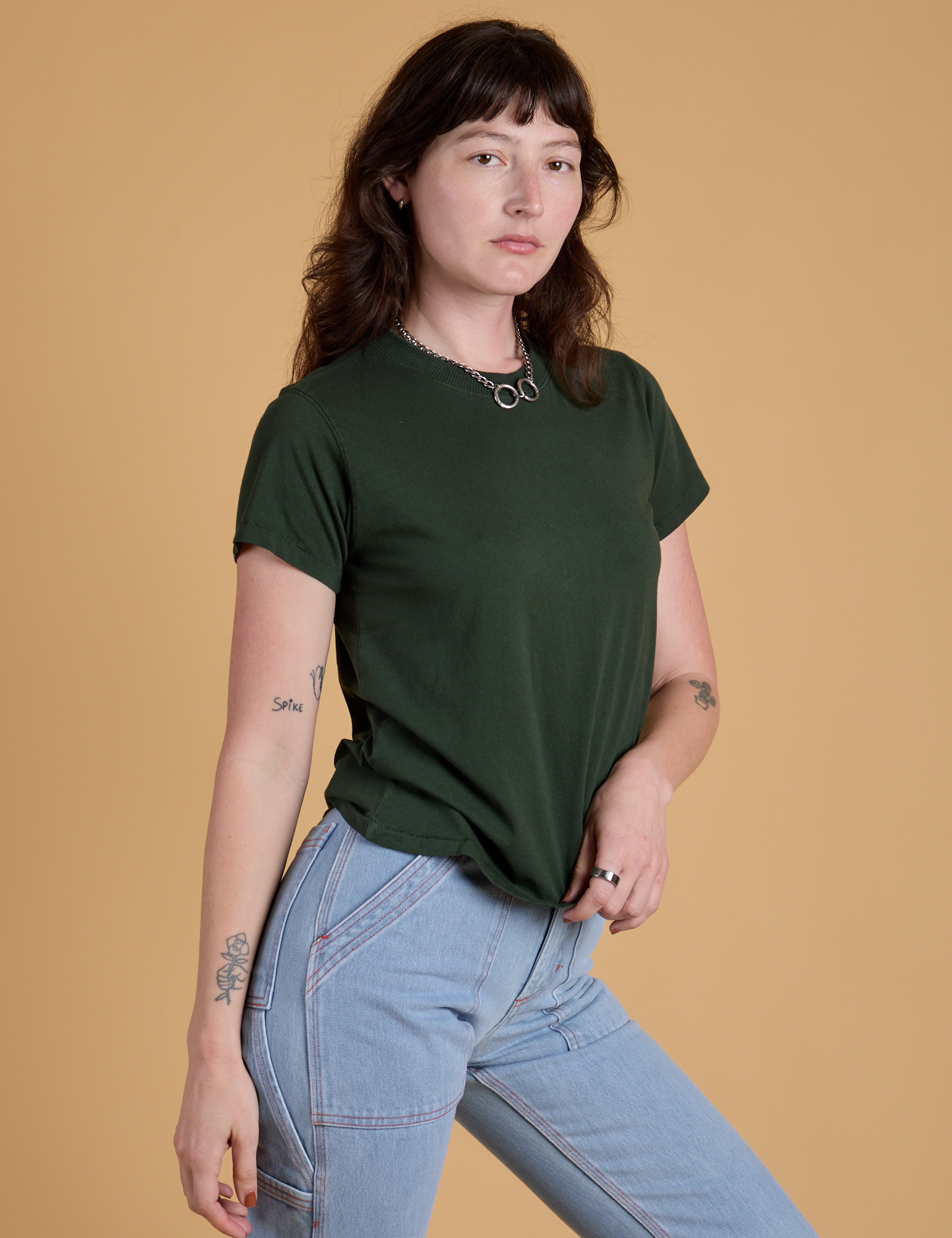 Angled front view of Organic Vintage Tee in Swamp Green on Alex
