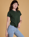 Angled front view of Organic Vintage Tee in Swamp Green on Alex