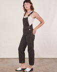 Side view of Original Overalls in Mono Espresso and vintage off-white Cropped Tank Top worn by Alex.