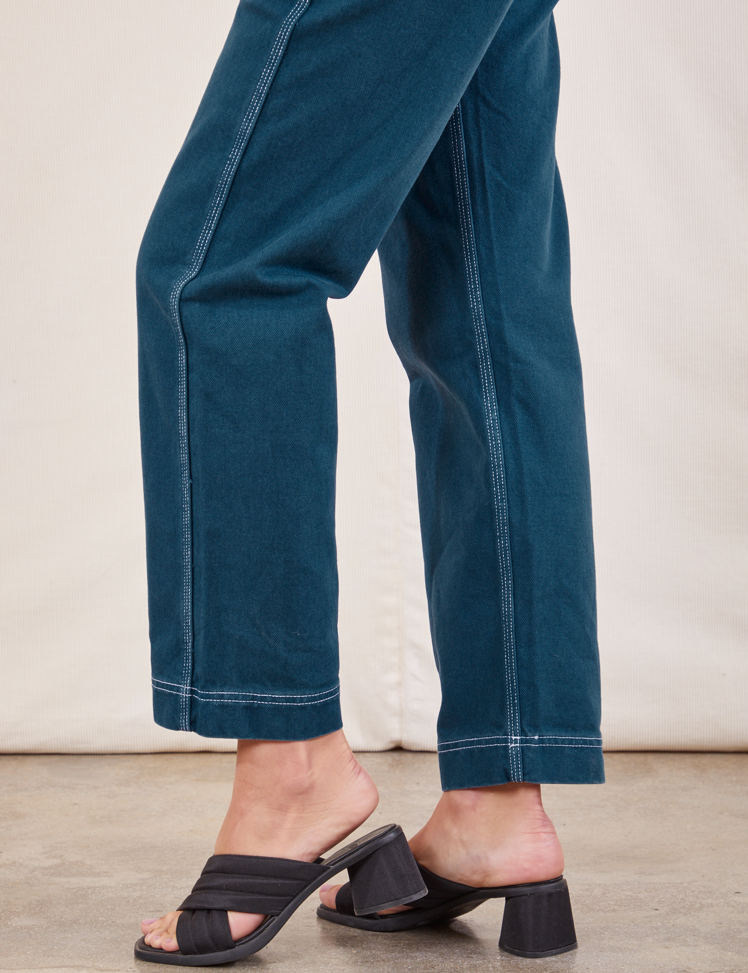 Original Overalls in Lagoon pant leg side view close up on Alex