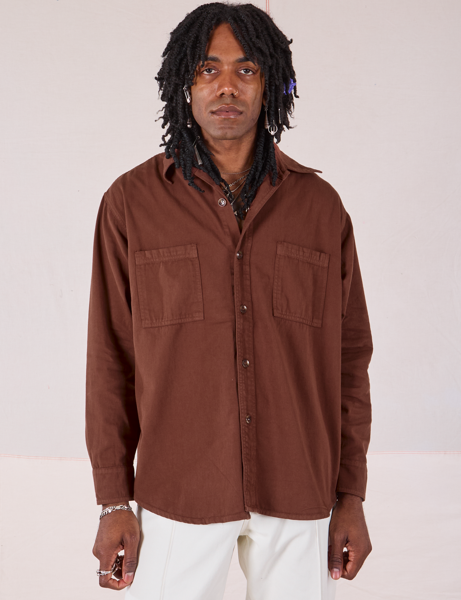 Jerrod is 6’3” and wearing S Twill Overshirt in Fudgesicle Brown