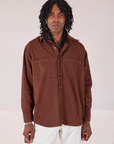 Jerrod is 6’3” and wearing S Twill Overshirt in Fudgesicle Brown