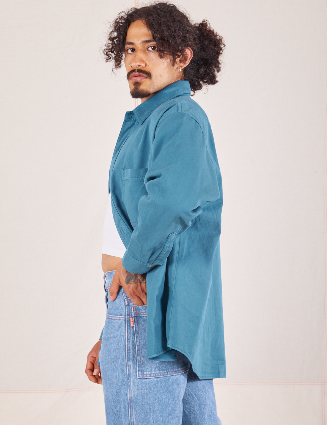 Side view of Oversize Overshirt in Marine Blue worn by Jesse