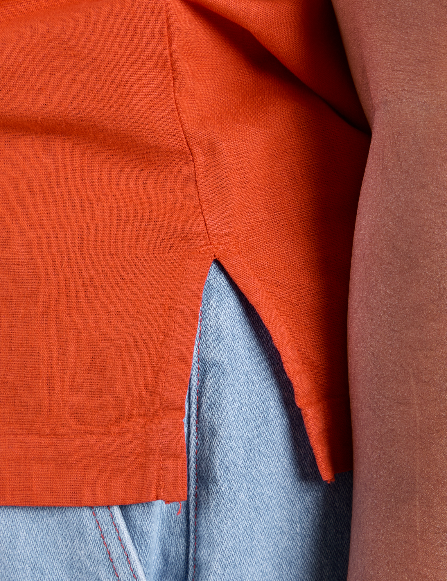 Close up of side vent of Pantry Button-Up in Chili Red