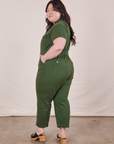 Petite Short Sleeve Jumpsuit in Dark Emerald Green side view on Ashley