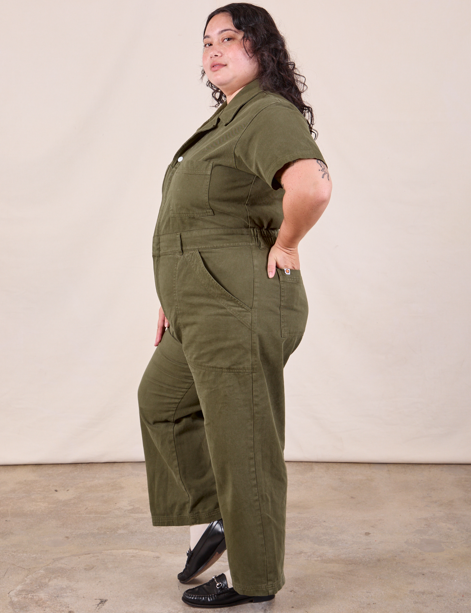 Petite Short Sleeve Jumpsuit in Surplus Green side view on Ari