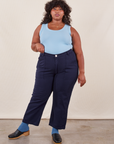 Morgan is 5'5" and wearing Petite 1XL Work Pants in Navy Blue paired with baby blue Tank Top