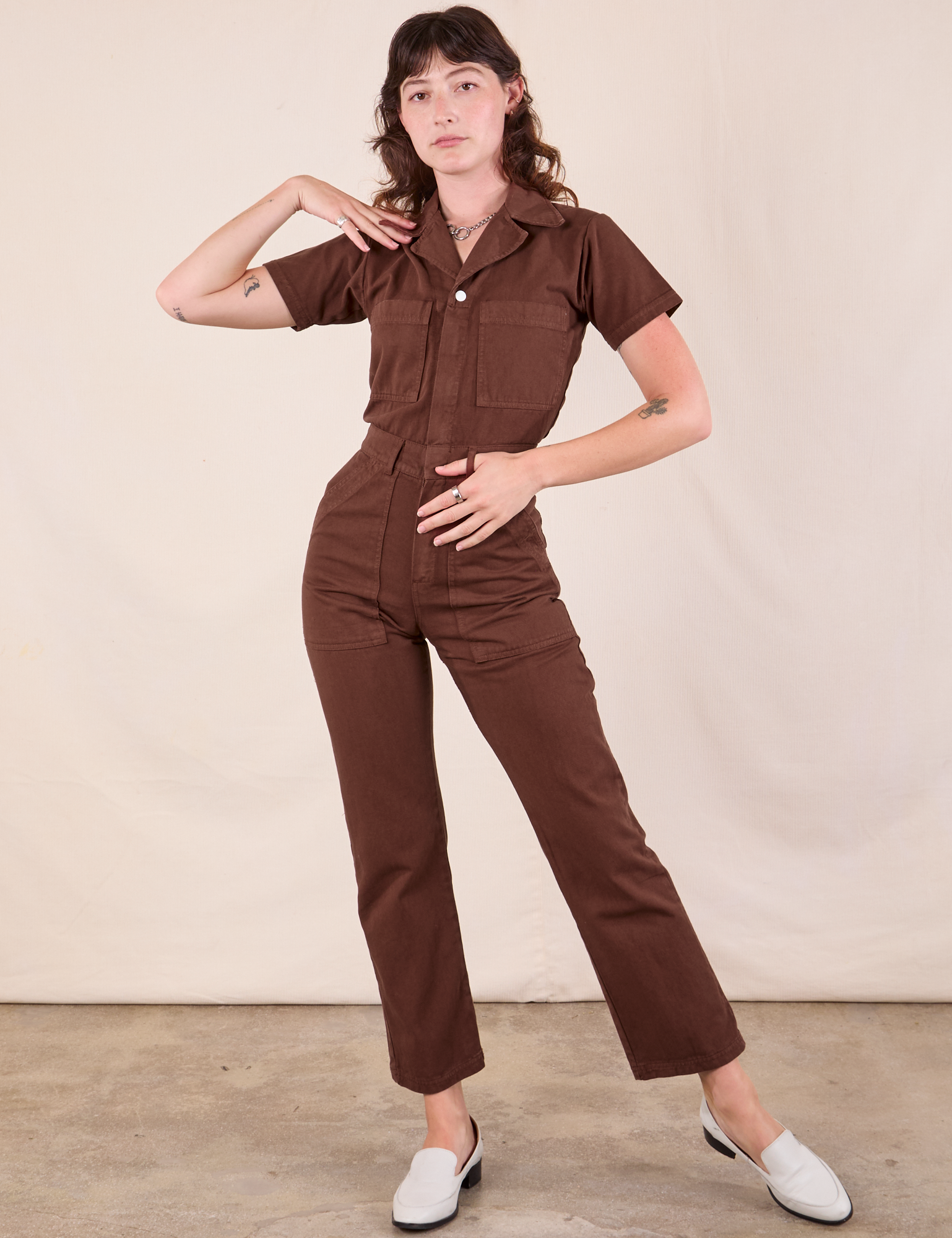 Alex is 5&#39;8&quot; and wearing XXS Short Sleeve Jumpsuit in Fudgesicle Brown