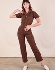 Alex is 5'8" and wearing XXS Short Sleeve Jumpsuit in Fudgesicle Brown