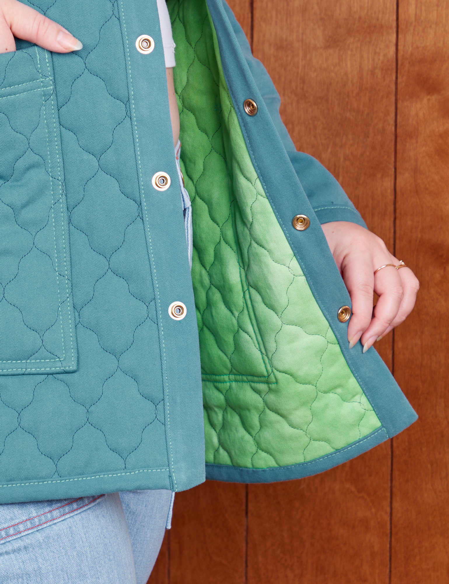 Quilted Overcoat in Marine Blue interior fabric close up in a green tonal tie dye
