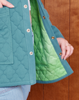 Quilted Overcoat in Marine Blue interior fabric close up in a green tonal tie dye