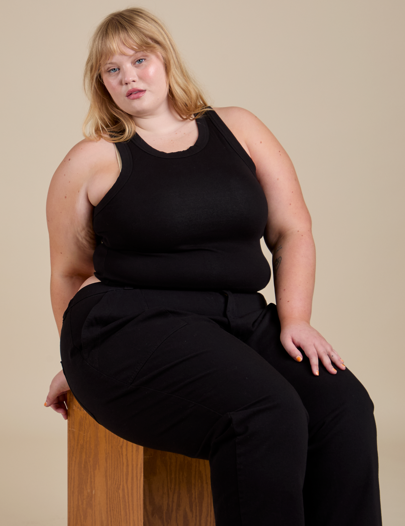 Racerback Tank in Black and Work Pants in Black worn by Juliet