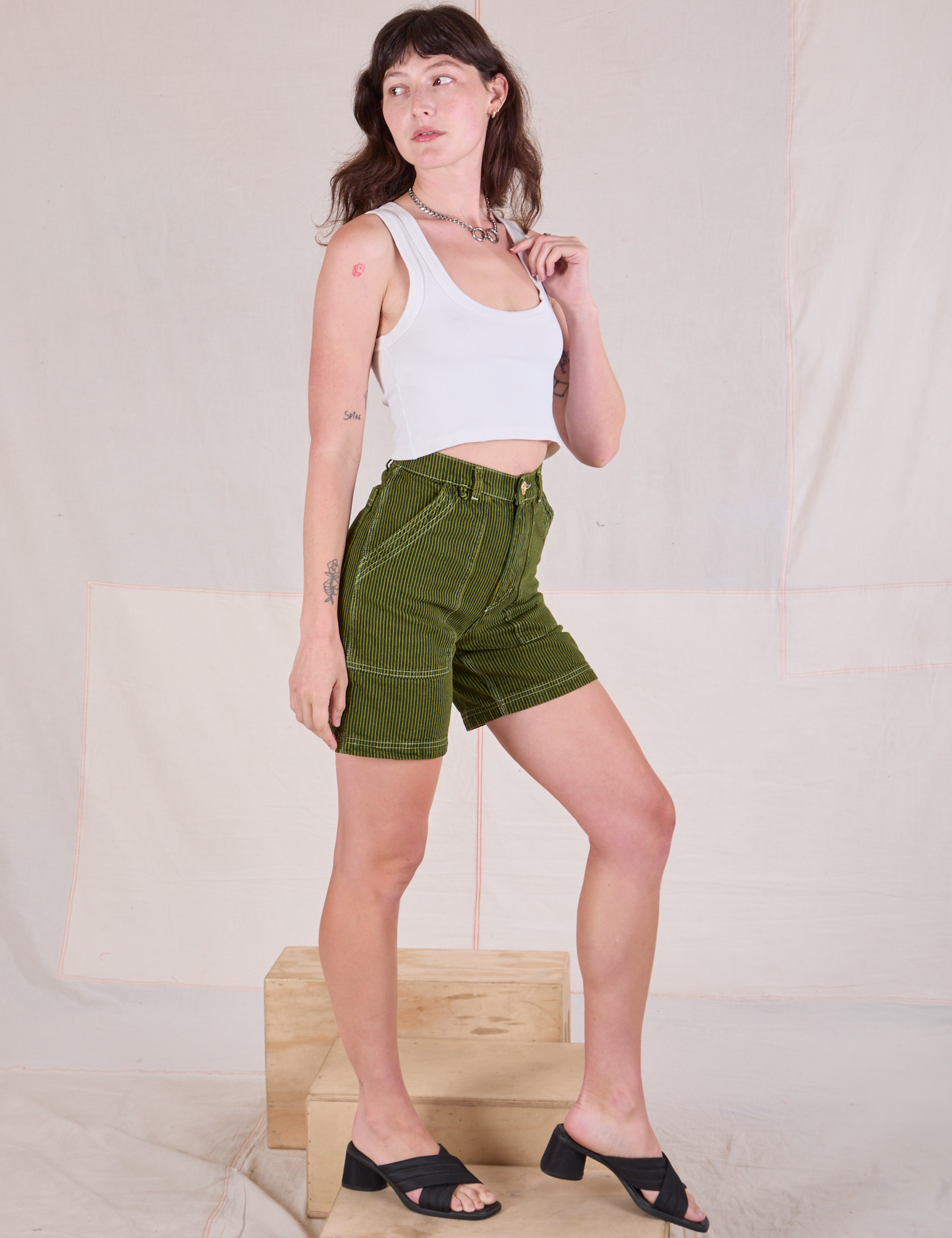 Railroad Carpenter Shorts in Summer Olive and Cropped Tank in Vintage Tee Off-White side view on Alex