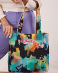Rainbow Magic Waters Shopper Tote hanging from Tiara's arm.