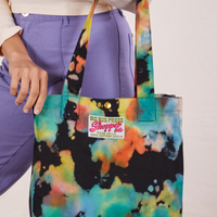 Rainbow Magic Waters Shopper Tote hanging from Tiara's arm.