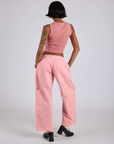 Back view of Drop Pocket Cargo Pants in Baby Pink and matching Muscle Tee on Kira