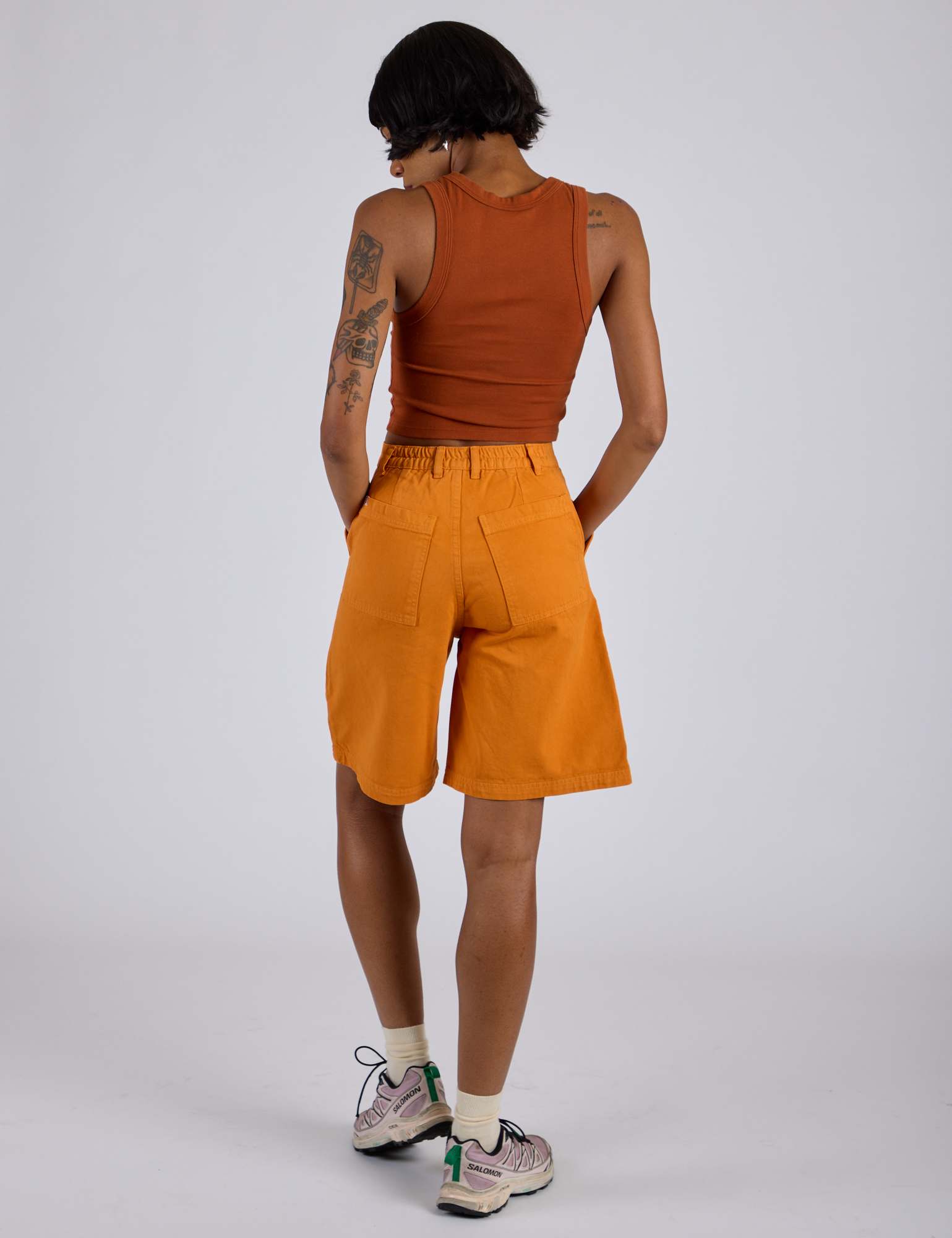 Back view of Longline Work Shorts in Creamsicle Orange and burnt terracotta Cropped Tank