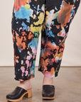 Pant leg close up of Petite Short Sleeve Jumpsuit in Rainbow Magic Waters worn by Ashley