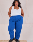 Morgan is 5'5" and wearing 1XL Heavyweight Trousers in Royal Blue paired with a Cropped Tank in Vintage Tee Off-White