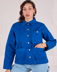 Tiara is wearing a buttoned up Denim Work Jacket in Royal Blue