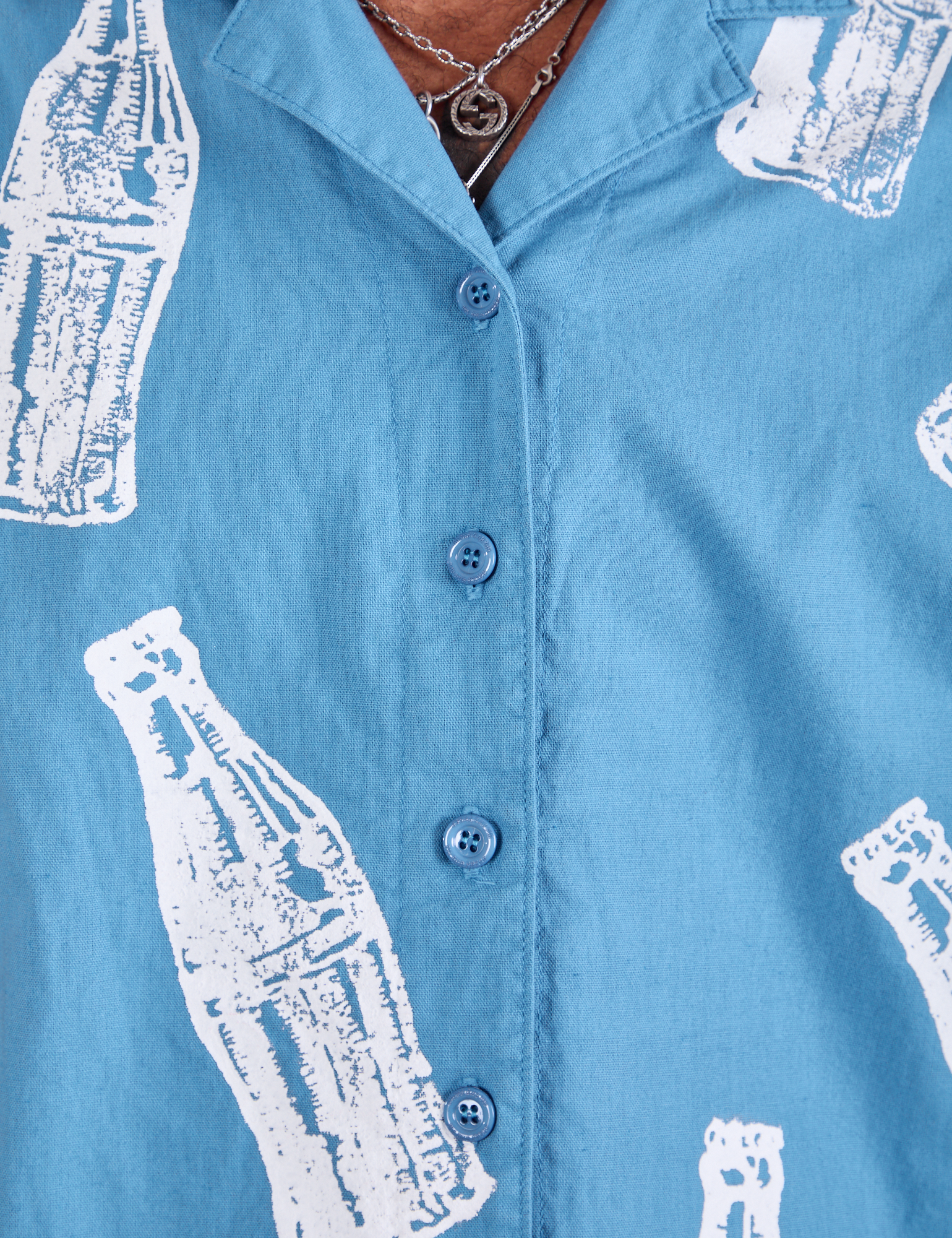Soda Bottle Pantry Button-Up in Greek Blue close up on Jerrod