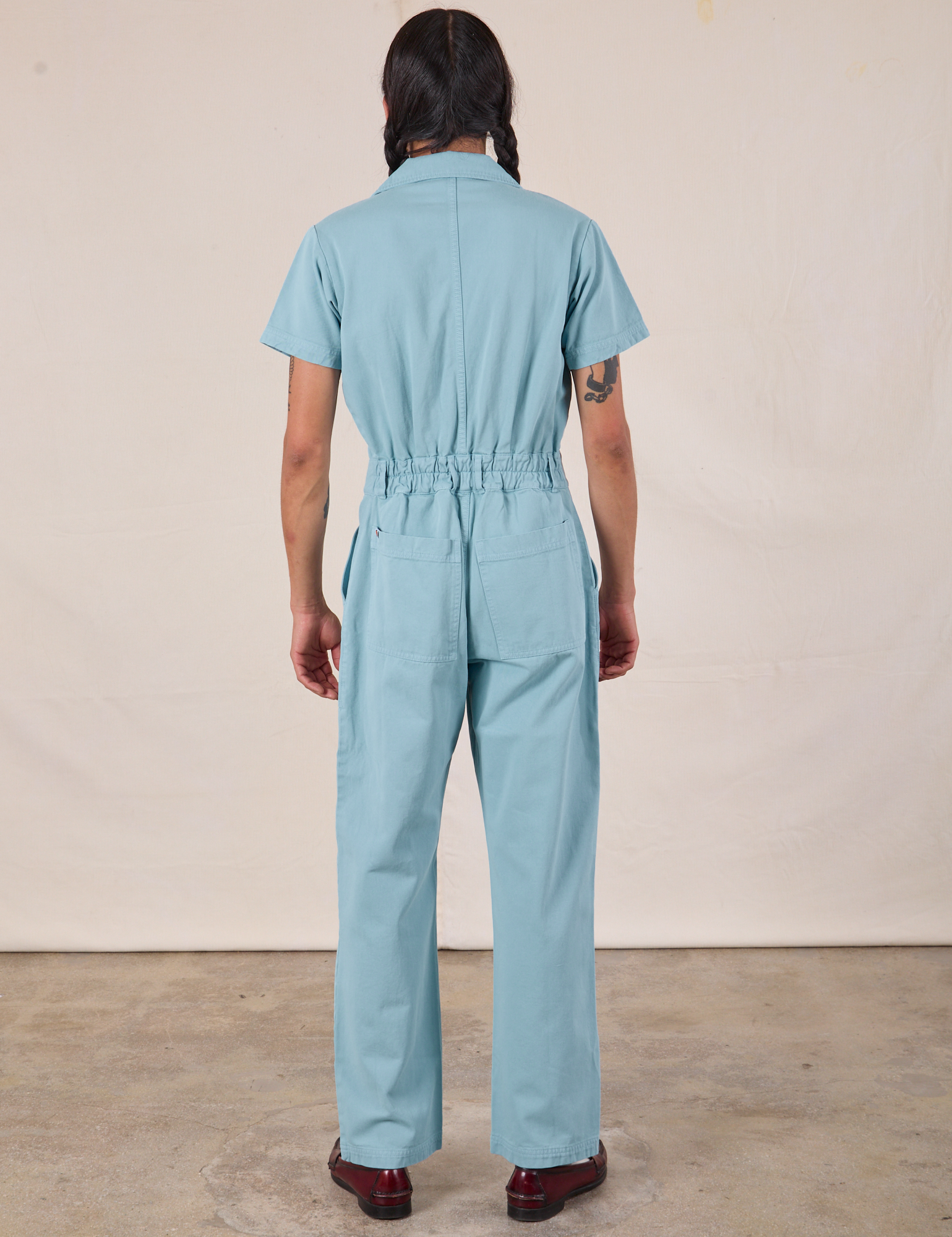 Short Sleeve Jumpsuit in Baby Blue back view on Anthony