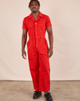 Issac is 5'10" and wearing M Short Sleeve Jumpsuit in Mustang Red