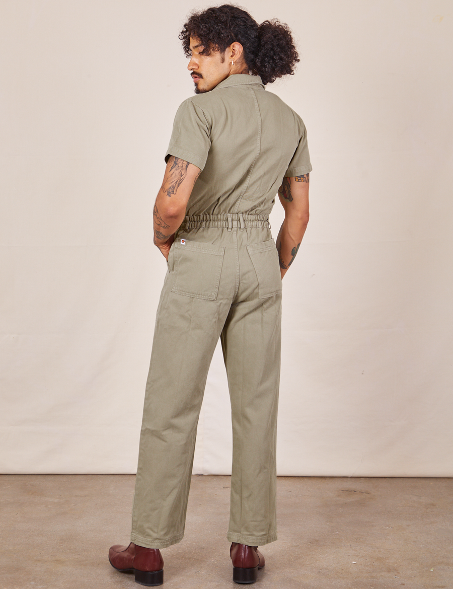 Back view of Short Sleeve Jumpsuit in Khaki Grey worn by Jesse