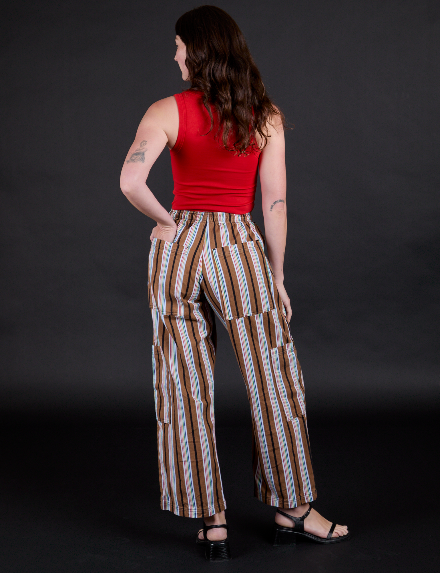 Striped Drop Pocket Pants in Retro Rainbow back view on Alex