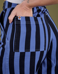 Close up of Alex's hand in the back pocket of Longline Work Shorts in Cornflower
