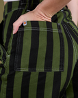 Close up of Alex's hand in the front pocket of Longline Work Shorts in Evergreen