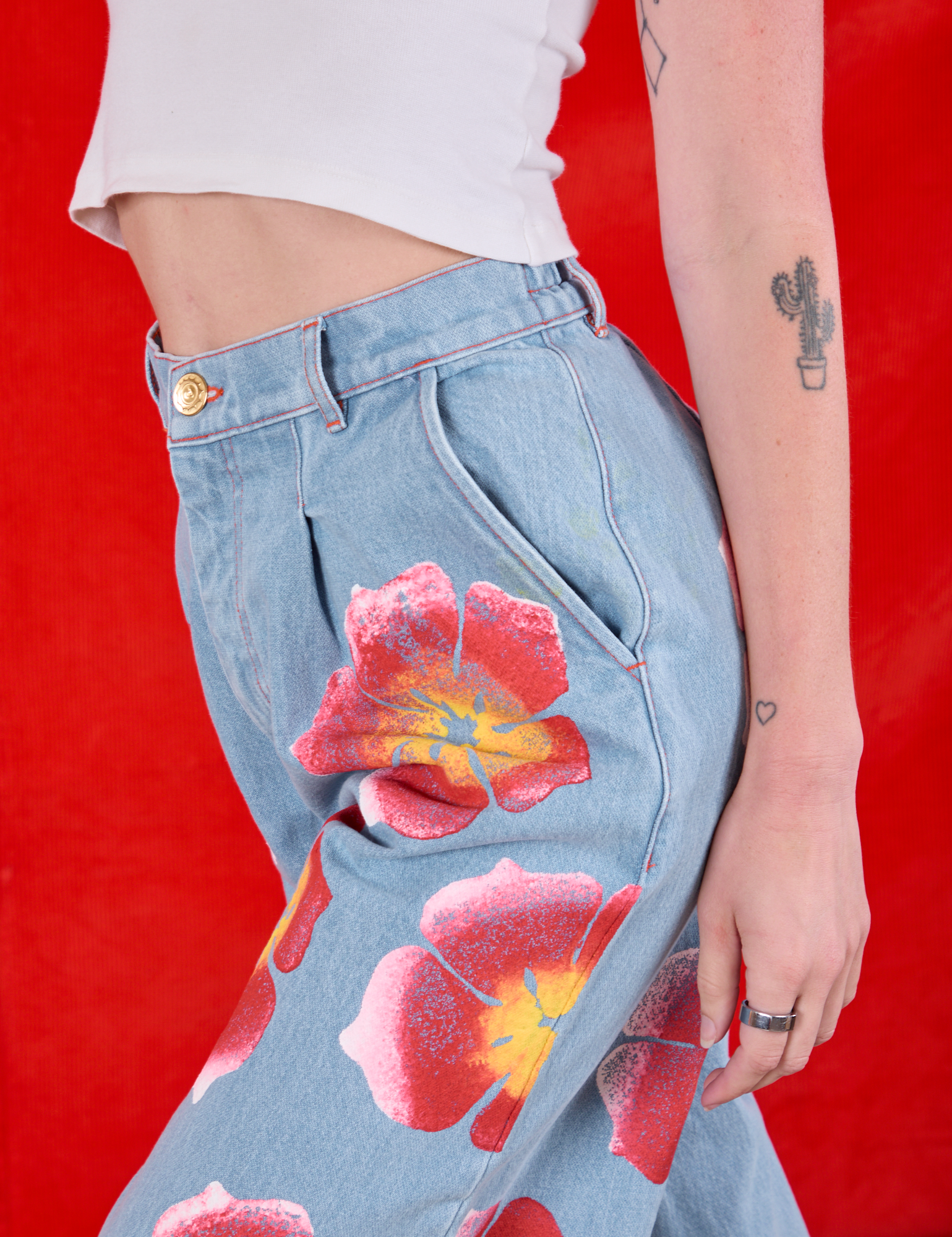 Wide Leg Denim Trousers in Painted Flowers side close up on Alex