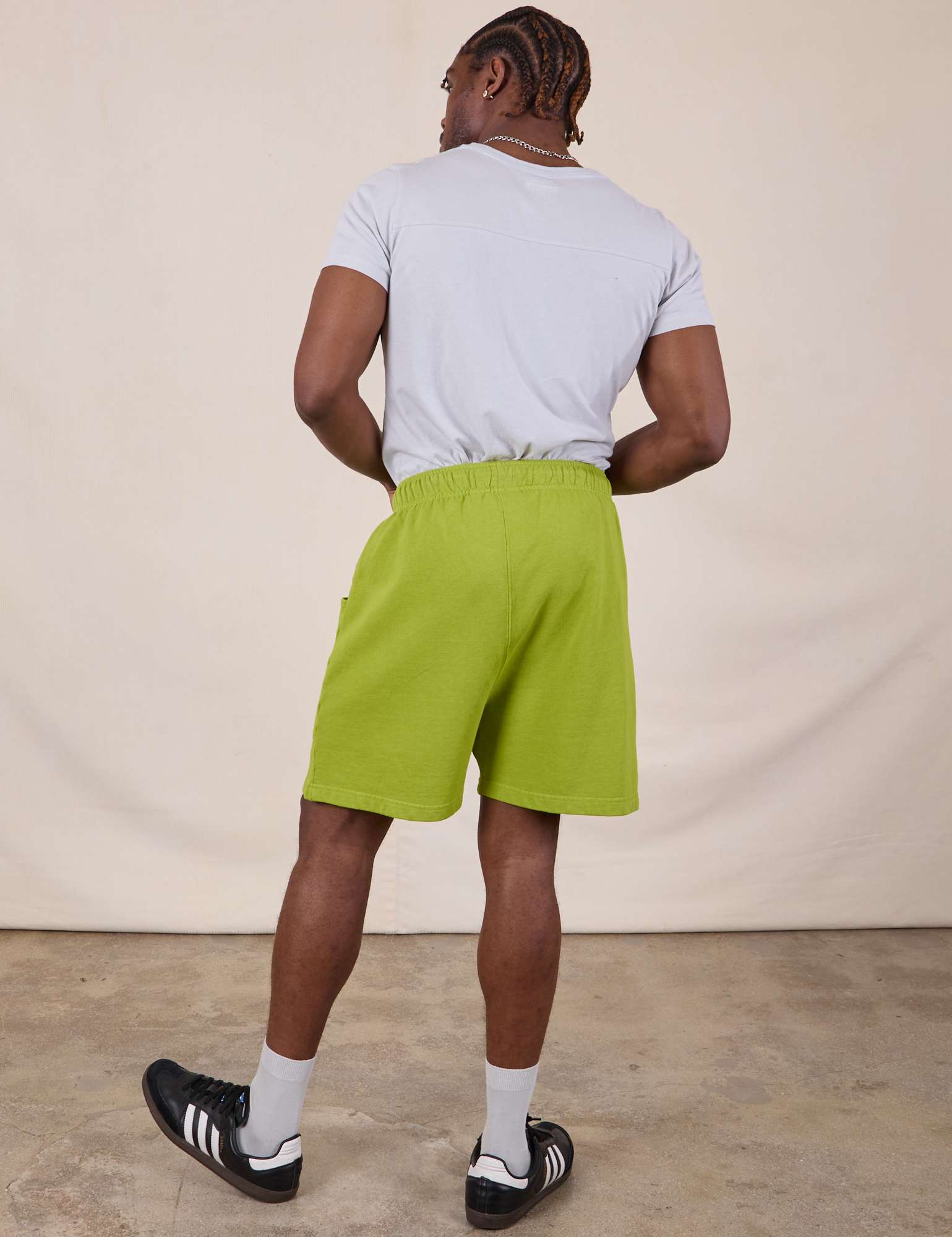Back view of Sweat Shorts in Gross Green and Jr. Varsity Tee in Stone White  on Isaac
