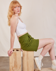 Margart is wearing Lightweight Sweat Shorts in Summer Olive and Cropped Tank in vintage tee off-white