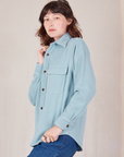 Angled front view of Flannel Overshirt in Baby Blue on Alex