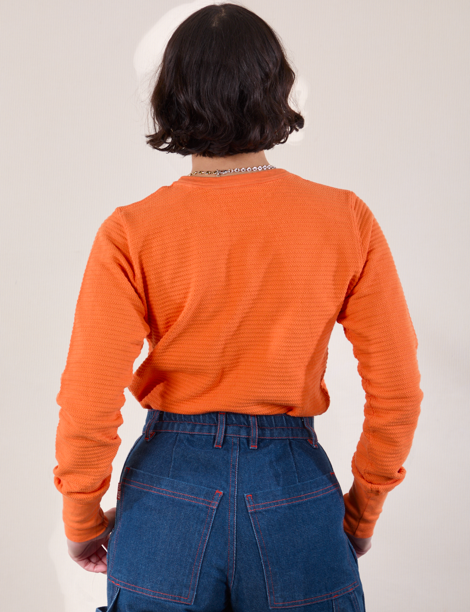 Honeycomb Thermal in Construction Orange back view on Soraya