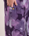Close up of Juliet's hand in the pant leg pocket of Magic Waters Drop Pocket Pants in Dark Lavender