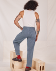 Back view of Denim Trouser Jeans in Railroad Stripe and vintage off-white Tank Top worn by Jesse