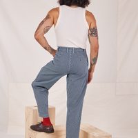 Back view of Denim Trouser Jeans in Railroad Stripe and vintage off-white Tank Top worn by Jesse